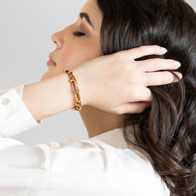 PULSEIRA LÚMEN - Feita à mão - Banhada a ouro de 24 quilates - Couro